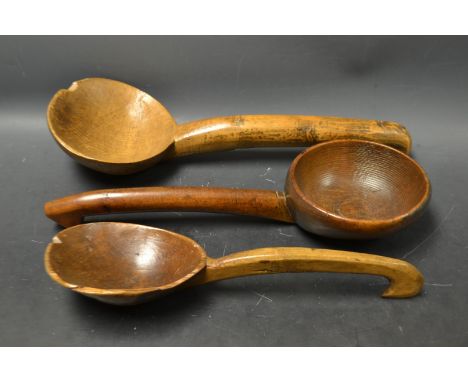 A Welsh sycamore ladle, 41cm long; others, similar 38cm long and 33cm long (3)