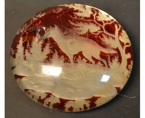 A 19th century Bohemian ruby glass paperweight, dog in a landscape