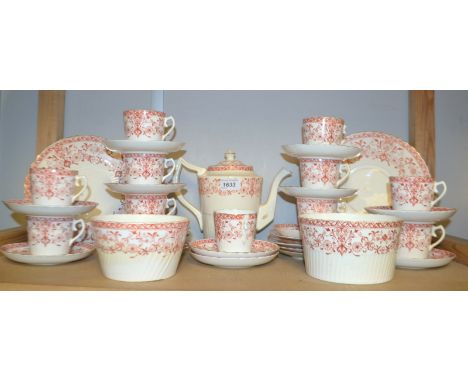 A Staffordshire coffee service decorated with orange flowers on a white ground, comprising coffee pot, eleven cups, twelve sa