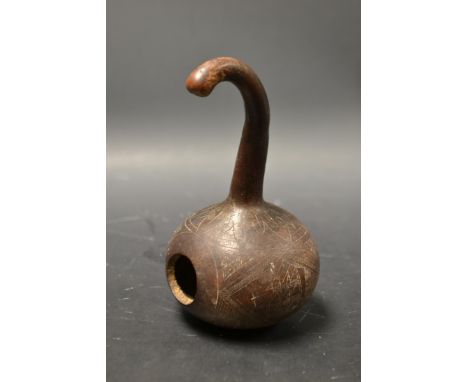 Folk Art - a calabash or bottle gourd, carved with a circular reserve of blossoming flowers and inscribed Recuerdo (Spanish f