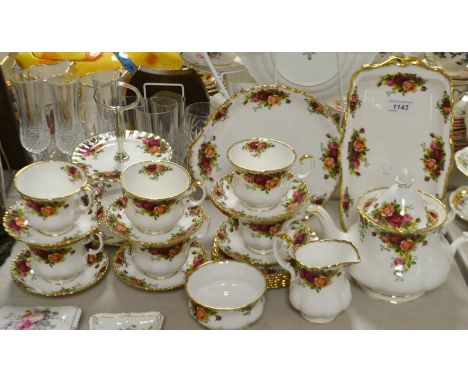A Royal Albert Old Country Roses six setting tea service including two tier cake stands, teapot, six trios, sandwich tray etc