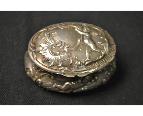 A 19th century oval silver cherub snuff box, gilt interior