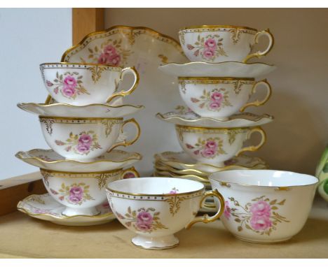 A Royal Crown Derby Pinxton Roses pattern tea service comprising, wavy edged plate, seven tea plates, seven cups and six sauc