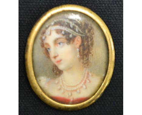 Indian School 19th century, portrait miniature, pearl bedecked maiden facing right, unsigned, 3.5cm high, yellow metal frame