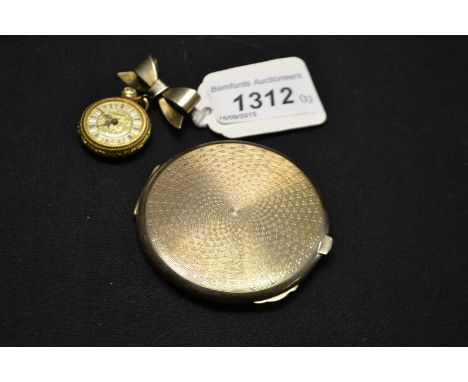 An early 20th century silver ladies compact; a ladies fob watch (2)  