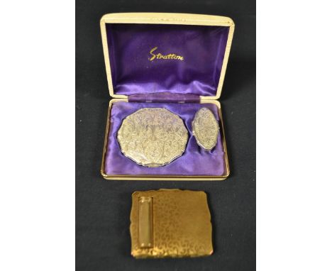 A Stratton compact and lipstick holder, cased; another Stratton compact with integrated lipstick (2)