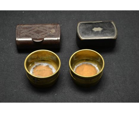 A Victorian/Villam IV black laquered rounded rectangular papier maché snuff box, another bacolite, a pair of Indecotts brass 