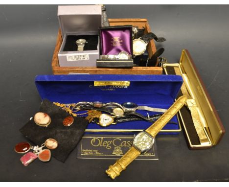  Watches - an Oleg Cassini dress watch, Mother of pearl heart shape dial, dot hour markers, quartz movement, boxed;  others, 