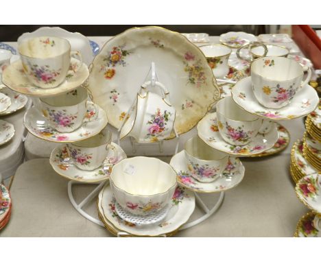 A Royal Crown Derby, posie tea service comprising, cake plate, six tea plates, six cups and saucers, milk mug and sugar bowl