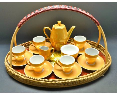 A Japanese egg shell porcelain coffee service, for six comprising coffee pot, sugar bowl, creamer, six cups and saucers, lust