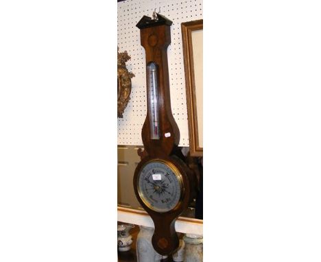 A reproduction wall barometer/thermometer