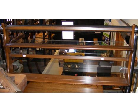 An Ercol wall plate rack - width 97cm 