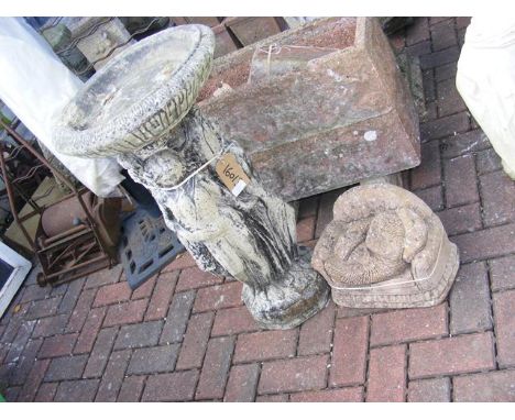 A figural birdbath - height 77cm, together with a model hedgehog on sofa 