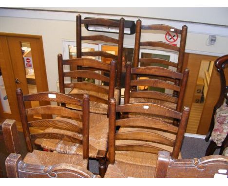 A set of six ladder back dining chairs with wicker seats 