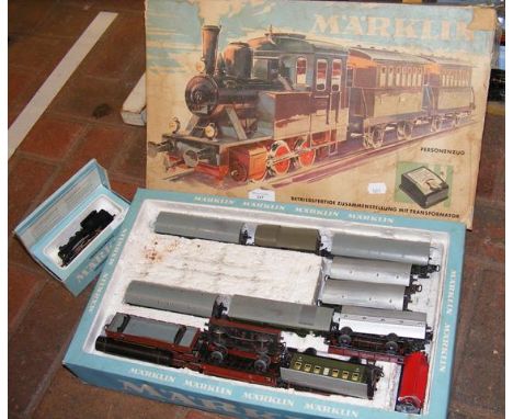 A boxed Marklin locomotive, together with other Marklin rolling stock