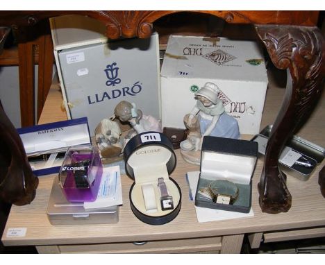 Lladro and Nao figures, together with wrist watches and pens 