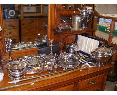 A shooting stick, walking sticks and a quantity of silver plate 