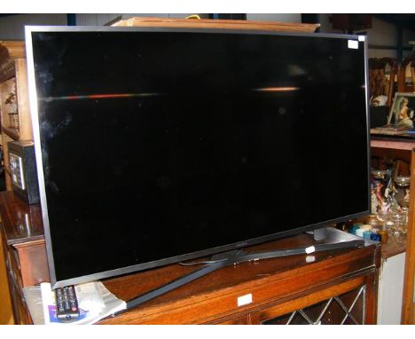 A Samsung Model UE40MU6470U 40 inch TV - complete with power cable and remote 