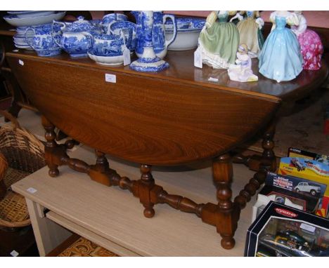 An Ercol drop-leaf coffee table - width 105cm 