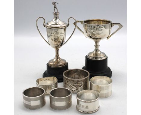 A George VI silver golfing trophy of small size with curved handles and removable cover with golfer cast finial, engraved "Ru