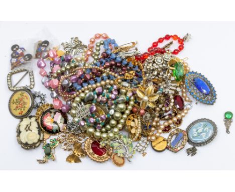 A collection of vintage costume jewellery to include paste set brooches and necklaces, paste set insect brooch, bead and faux