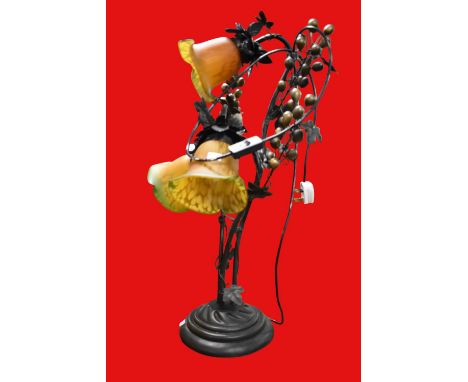 A reproduction Art Nouveau table lamp with gale style shade.