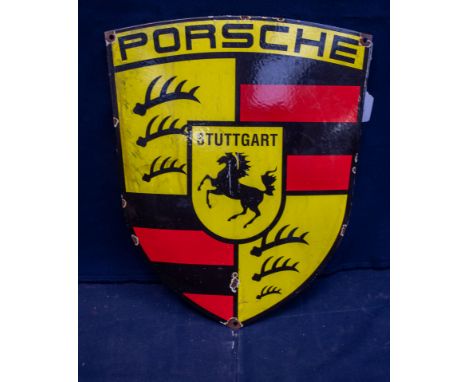  A REPRODUCTION shield shaped Porcsche Stuttgart enamel sign, with central black rearing horse, 45cm long