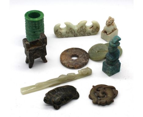 Assorted Chinese jade comprising of jade brush rest, 11.5cm wide; carved brown celadon pendant of a coiled dragon, 5cm diamet