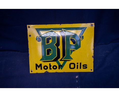  A REPRODUCTION rectangular yellow painted BP Motor Oil enamel sign, with green and black lettering, 30cm x 40cm 