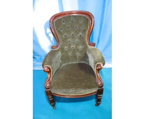 Two Victorian green velvet button back parlour chairs with mahogany frame.