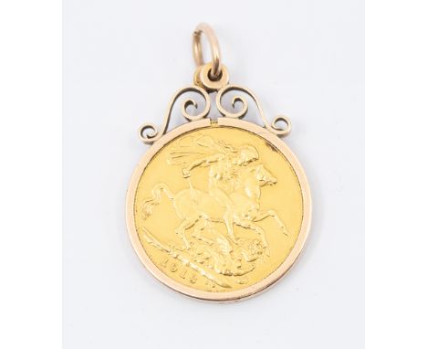 A George V mounted full sovereign dated 1918 in a 9ct gold pendant mount, weight approx 9.5gms  Further details: wear and tea