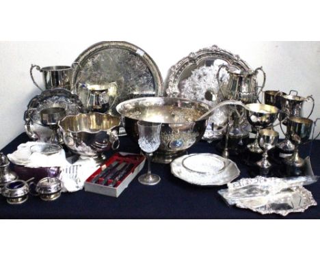 A large quantity of silver plated items to include; a large punch bowl, salvers and trays, boxed items, trophies, candlestick
