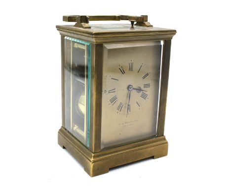 A late 19th Century French brass repeating carriage clock sold out of H.L. Brown &amp; Son, with gold face, Roman numerals, b