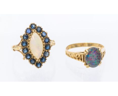 A sapphire and opal 9ct gold cluster ring, comprising a marquise shape set with central opal within a border of blue sapphire