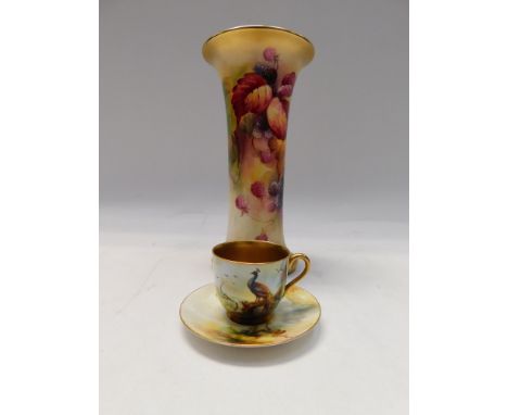A Royal Worcester small cup and saucer, hand painted by A. Watkins, decorated with a Peacock and branches with heavily gilt d