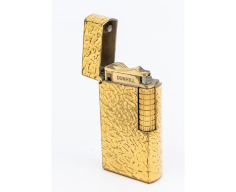 A plated Dunhill lighter, textured decoration   Further details: plate wear and tera commensurate with age  Please note colle