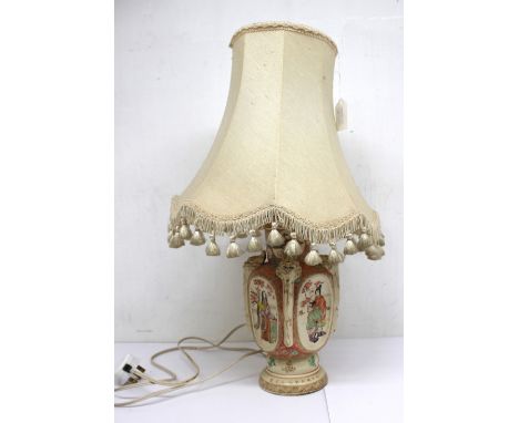A Japanese pottery vase, converted to a lamp base, decorated with figures and flowers, with bird detail, zig zag border rim a