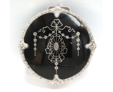 A George V silver and faux tortoiseshell circular trinket box, with inlayed silver neo-classical style design to cover, ornat
