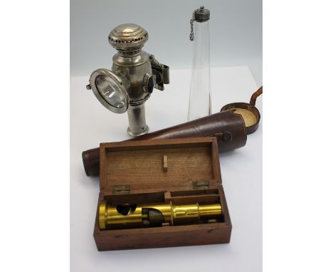 A John Lucas Ltd of Birmingham Candle Lamp, 20cm long together with a tapering glass flask and white metal lid with outer lea