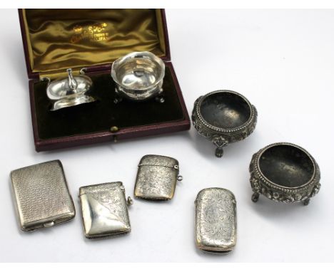 A collection of silver to include; a pair of Victorian silver cauldron salts, having embossed foliate and floral decoration, 
