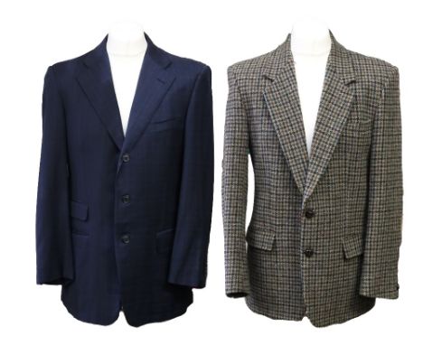 A classic Harris tweed jacket in a dark grey and mid brown, two button fastening, two flap pockets and suede elbow patches, s