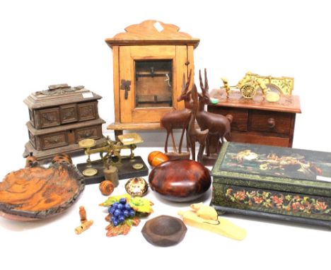 A collection of treen to include trinket boxes, key boxes, carved jewellery box, post office scales, nutshells and other tree