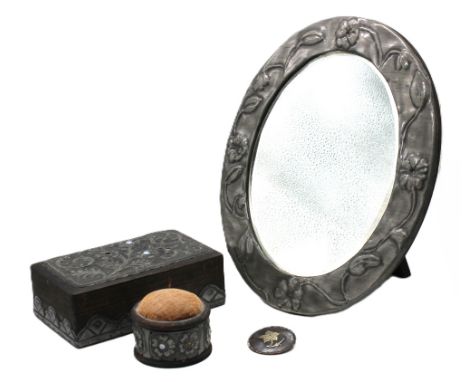 A collection of Arts & Crafts style items to include; an early to mid 20th century oval mirror, easel back with front pewter 