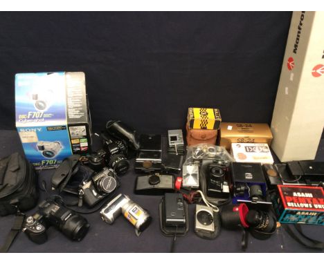 A collection of cameras and camera equipment to include; a boxed Sony DSC-F707 video camera; a Sony Cyber-shot 3.3 mega pixel