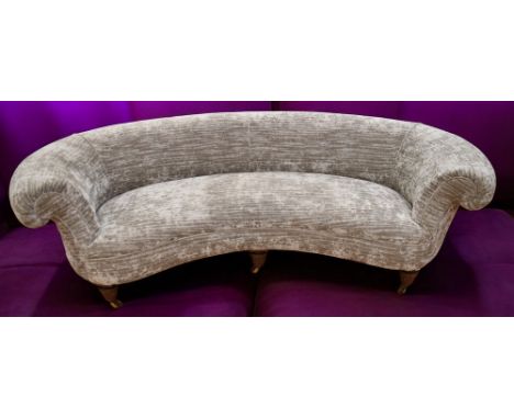 A 19th Century kidney shaped sofa, sofa has been reupholstered along with two 19th Century stools in mahogany.