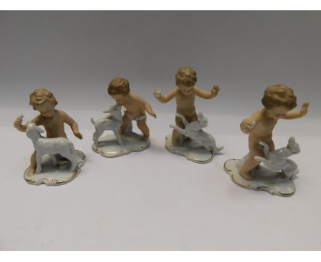 Four mid 20th Century continental wallendorf female figures playing with animals ,all&nbsp;good condition , no chips, cracks 