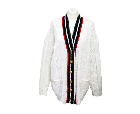 A collection of six belts and an Escada Sport white cable knit cardigan with green, white, red and black striped edging, patc