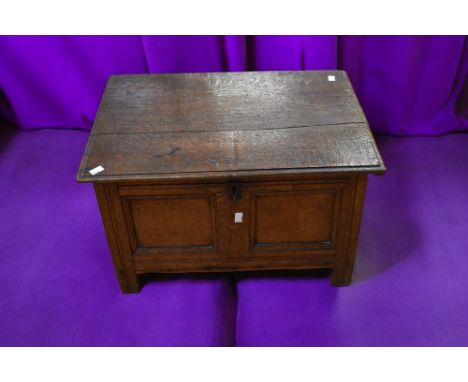 A small late 17th Century oak two panelled coffer, uncarved with plain top. standing on block legs along with a George II sol