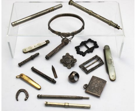 A small collection of silver items to include; a Victorian silver scarf clip, Birmingham, 1882; a Victorian silver vesta case