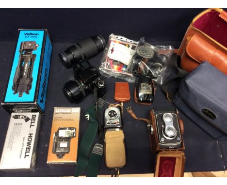 A quantity of various camera equipment equipment to include Canon EOS, various filters and a Yashica camera